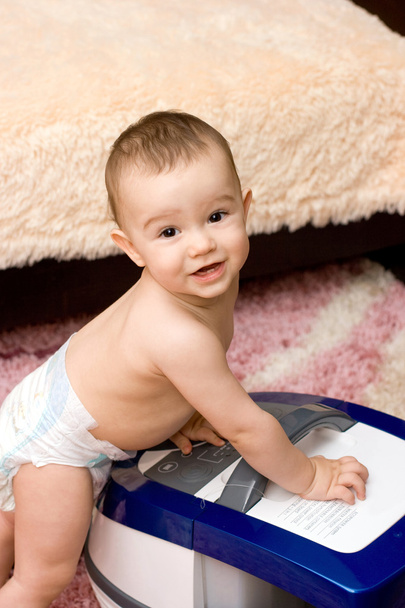 Cute caucasian baby with vacuum cleaner - Fotoğraf, Görsel