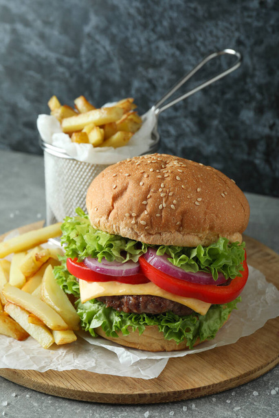 Concept of tasty food with delicious burger - Zdjęcie, obraz