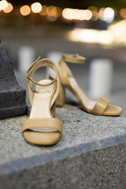 Luxury gold heels in the night city - Zdjęcie, obraz