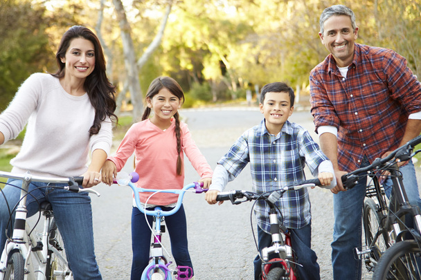 Portrait Of Hispanic Family On Cycle Ride In Countryside - Фото, изображение
