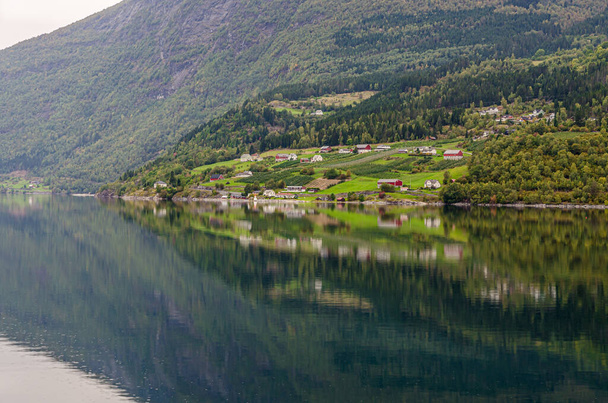 Reflection in Norway fjord at fall time - Foto, imagen