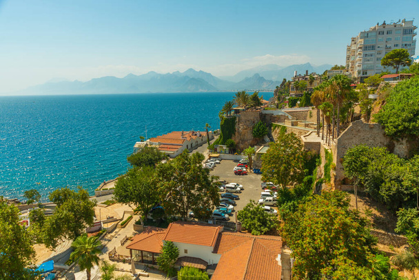 ANTALYA, TURKEY: Beautiful top view of the old town, the sea and the mountains on a sunny summer day in Antalya, Turkey. - Фото, изображение