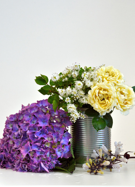 A Simple display of flowers in a can - Photo, Image