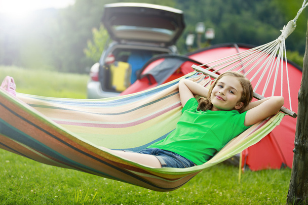Summer in the tent - young girl with family on the camping - Photo, Image