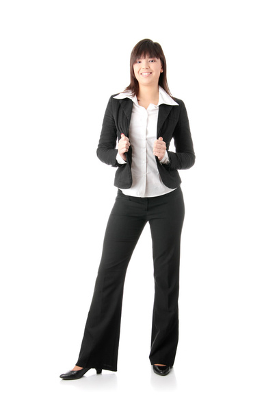 Confident business woman standing wearing elegant clothes - isolated over a white background - Fotoğraf, Görsel
