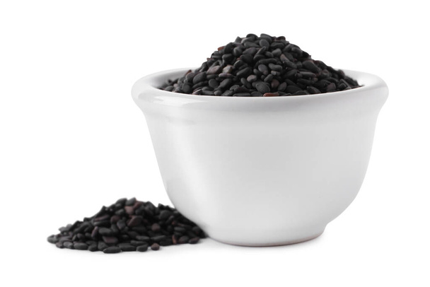 Raw black sesame seeds with bowl on white background - Foto, Bild