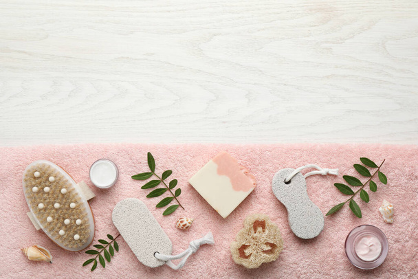Flat lay composition with pumice stones on white wooden background. Space for text - Foto, imagen
