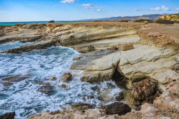 The coast of Cape Drepano, due to its geological structure, is famous for its quaint landscape and is one of the natural attractions of Cyprus.     - Zdjęcie, obraz