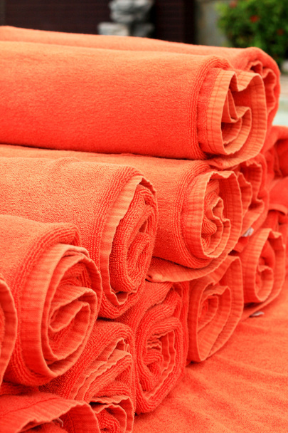 A lot orange towels by the pool. - Photo, Image