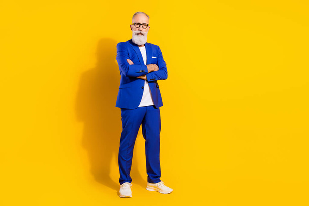 Full length body size view of attractive chic serious man folded arms isolated over bright yellow color background - Valokuva, kuva