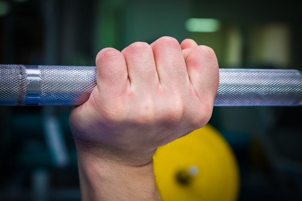 Hand holding barbell - Photo, image