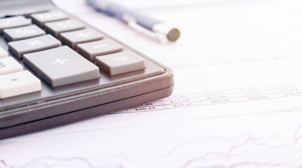 Balance sheet ,pencil, calculator on accountant's desk. Accounting , accounts concept. top view, above view. - Fotó, kép