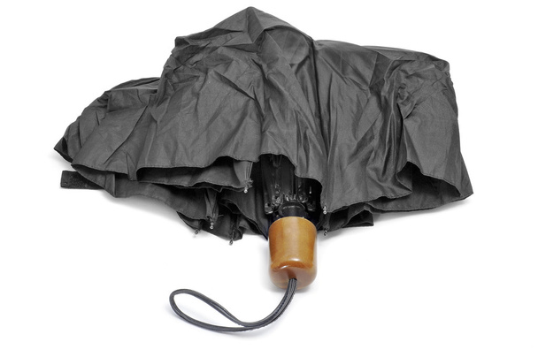 een zwarte paraplu geïsoleerd op een witte achtergrond - Foto, afbeelding