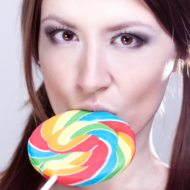 Girl sucks big candy - Фото, зображення