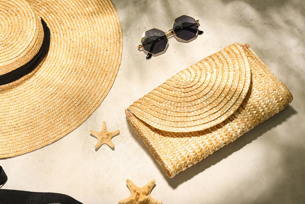 Stylish hat, bag and sunglasses on light background - Foto, afbeelding