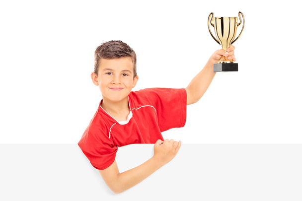 Junior athlete holding trophy - Foto, Imagen