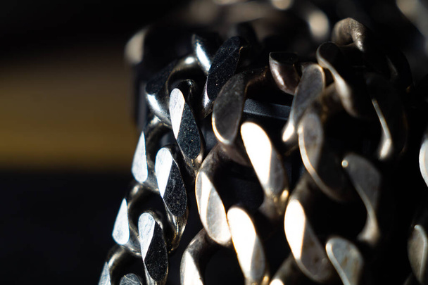 A closeup shot of details on a heavy silver chain - Фото, изображение