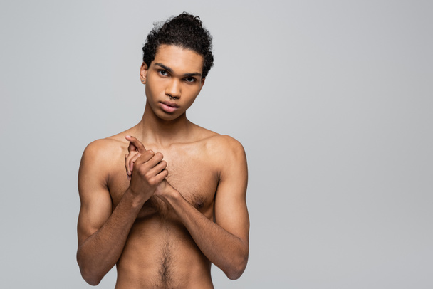 front view of shirtless african american looking at camera man isolated on grey, beauty concept - Photo, Image