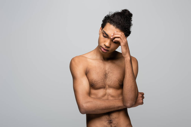 shirtless african american man touching forehead isolated on grey, beauty concept - Foto, imagen