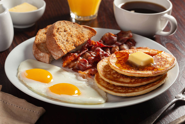 traditional full american breakfast eggs pancakes with bacon and toast - Photo, Image