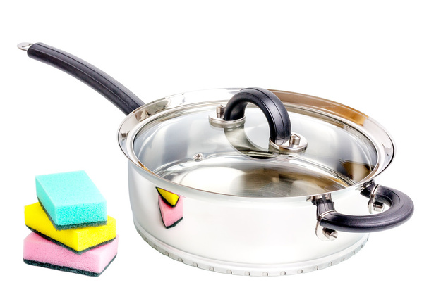 Stainless steel deep stewing pan with sponges on white background - Photo, Image