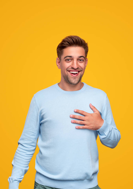 Pleased man touching chest in gratitude - Photo, Image