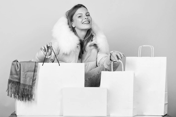 Thanks for your purchase. girl shopping bags. christmas shopping sales. fun and gifts. black friday. happy new year. xmas presents. winter holidays and vacation. woman in down jacket - Fotografie, Obrázek