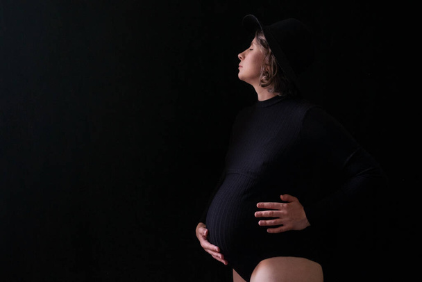 Pregnant caucasian woman touching her belly. Waiting for baby - Fotografie, Obrázek