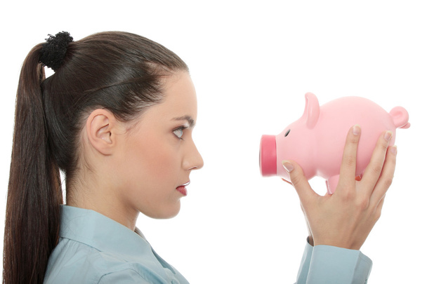 Businesswoman holding piggy bank. Isolated on white background - Photo, image