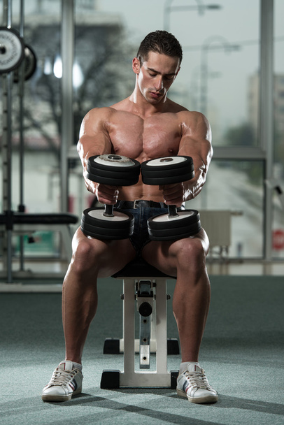 Young Man Working Out Biceps - Foto, imagen