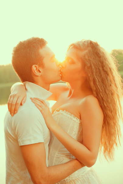 Loving couple hugging on the lake. Beauty young woman and man in - Photo, Image