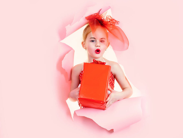 Childhood and happiness, gift box. Boxing day, holiday celebration and party. Birthday and christmas. Child girl with present pack, cyber monday. Small girl with shopping package, black friday. - 写真・画像