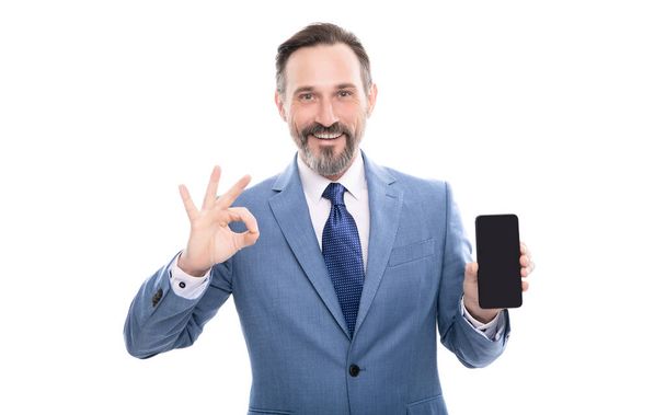 advertisement presentation. copy space. grizzled man presenting phone screen. - Photo, Image