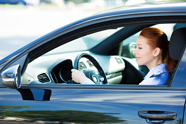 Woman driving car, follows traffic rules, precautions  - Фото, зображення
