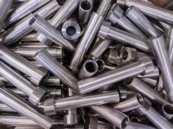 pile of shiny steel tubes after cnc turning operations - abstract full frame indistrial background - Photo, Image