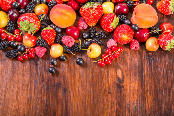 fresh berries on wooden table - Photo, image