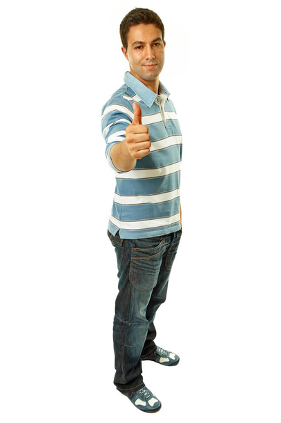 Young casual man going thumb up in a white background - Foto, imagen