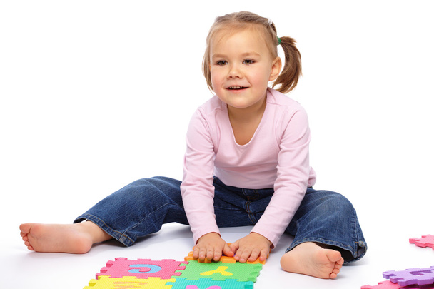 Little girl with alphabet - Zdjęcie, obraz