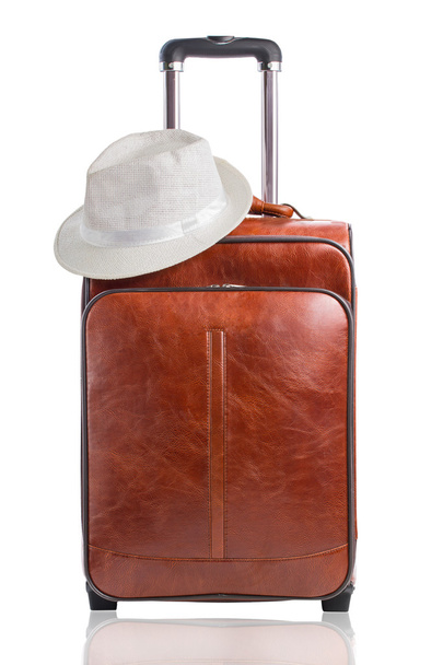 Leather suitcase and hat - Фото, изображение