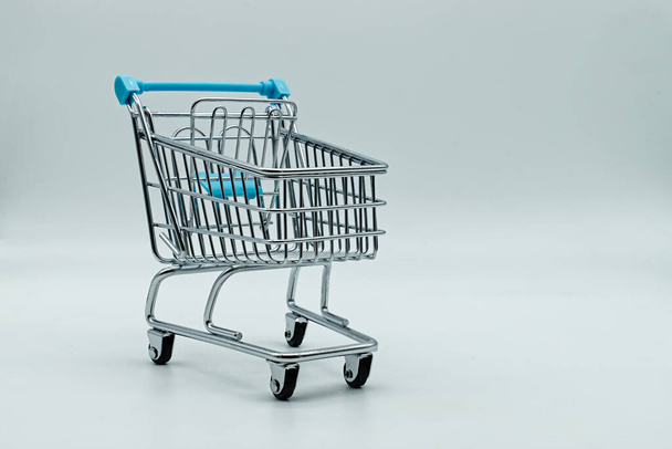 Empty shopping cart isolated on white background. - Фото, изображение