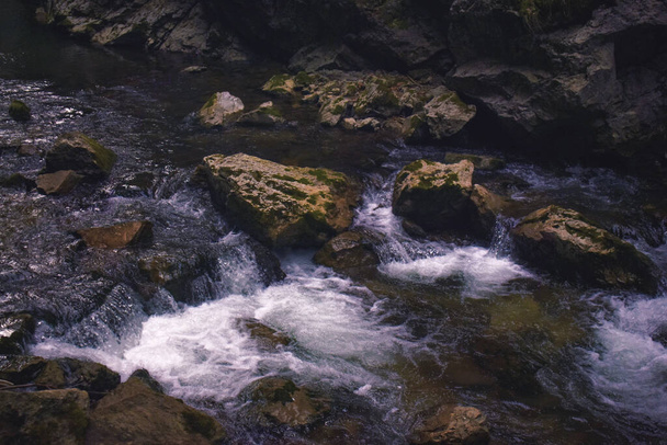 A closeup shot of a waterfall in rocks - Photo, Image