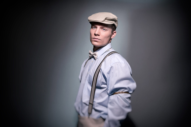 Retro classic dandy fashion man wearing cap with blue shirt brac - Zdjęcie, obraz