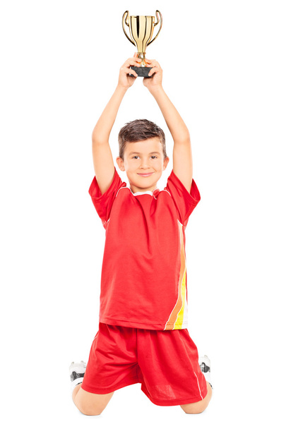 Little boy holding trophy - Фото, изображение