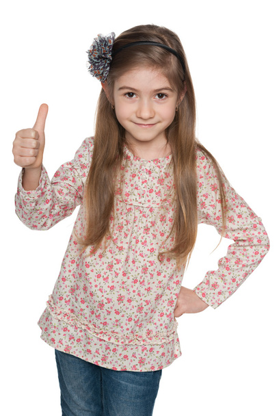 Cheerful fashion young girl holds her thumbs up - Фото, изображение
