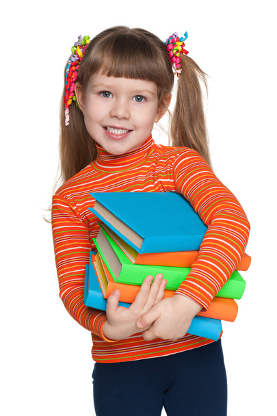 Happy little girl with books - Fotó, kép