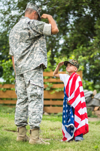 American soldier and his son salute each other - Fotoğraf, Görsel