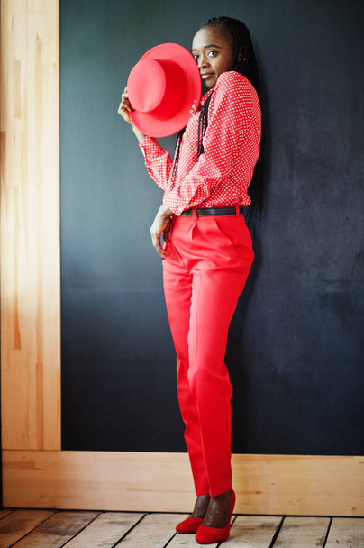 Pretty braids business african american lady bright bossy person friendly wear office red shirt, hat and trousers.  - Fotoğraf, Görsel