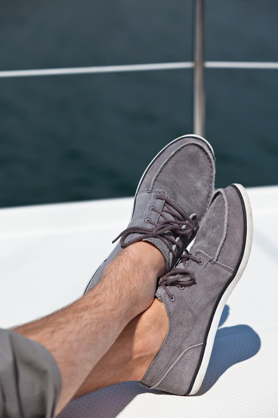 A pair of hairy man legs in topsiders - Photo, Image