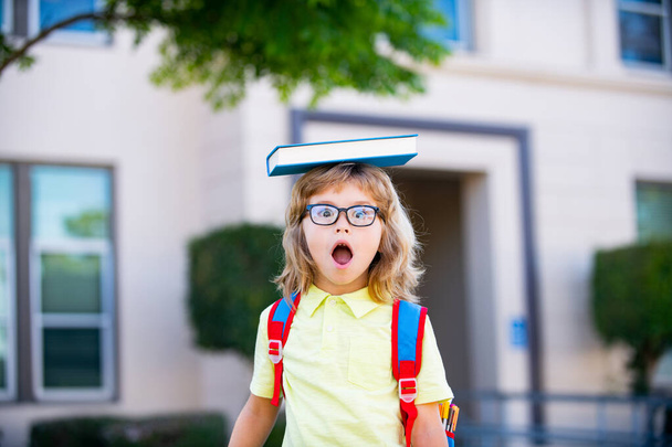 Back to school. Cute child girl with backpack going to school with fun. - Photo, image