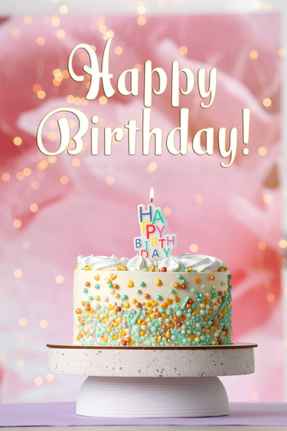 Happy Birthday! Beautiful cake with burning candle on violet table - Фото, зображення